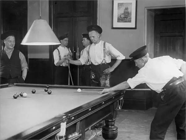 Firefighters playing billiards in fire station