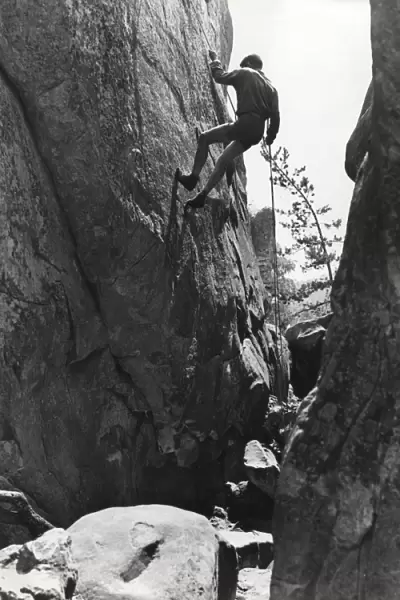 French boy scout rock climbing