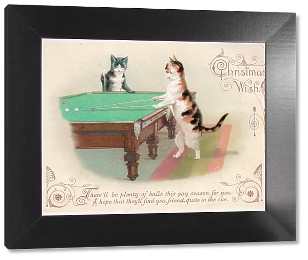 Two cats playing billiards on a Christmas card