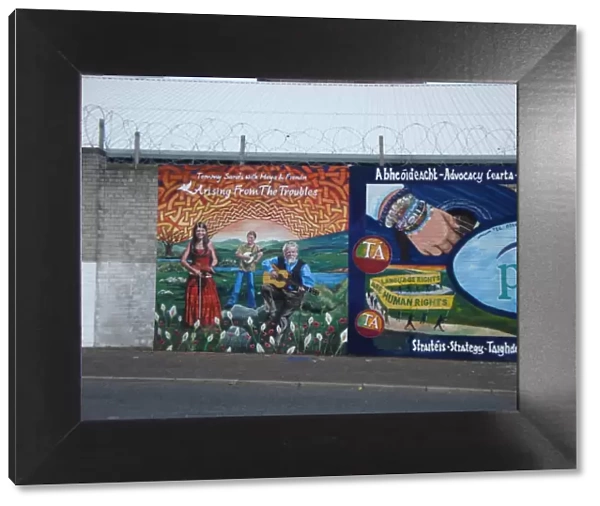 Wall mural of Tommy Sands with Moya & Fionan at Belfast