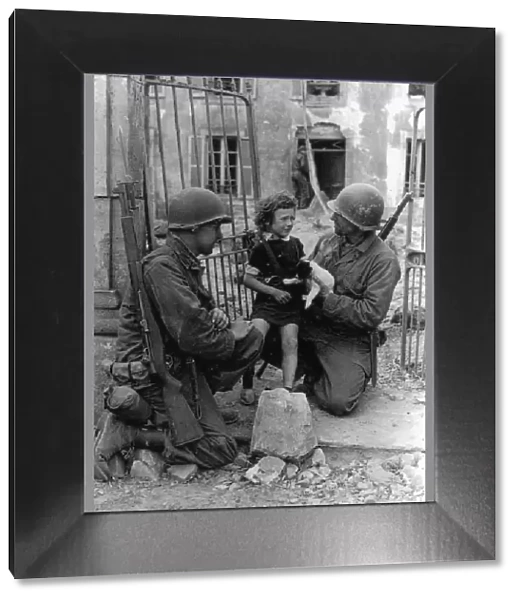 WW2 - US Troops comfort a distressed child and puppy