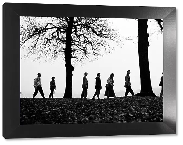 Walkers on the brow of a hill making a silhouette