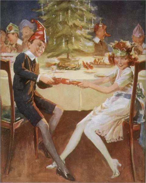 Boy and girl in paper hats pull a cracker at the party table Date: circa 1929