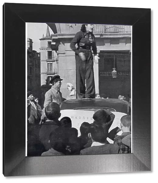 A female Republican supporter giving a speech on top of a car, Madrid, 1936. It was reported that she was calling for more volunteers to join the Republican army. Date: 1936
