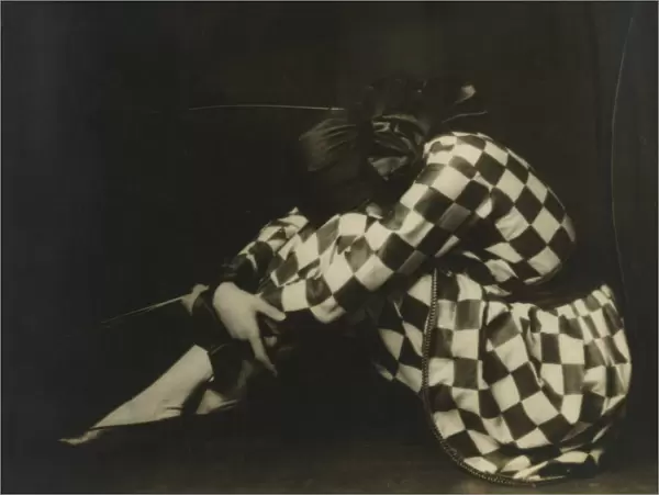 Yevonde Cumbers Middleton (1893-1975), also known professionally as Madame Yevonde, posing as Harlequin in a 1923 self-portrait. Date: 1923