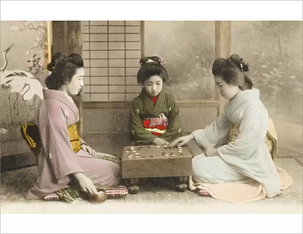 Three Japanese Geisha girls playing Go