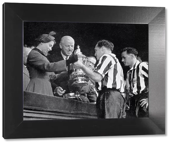 The Queen presents the F. A. Cup to Newcastle