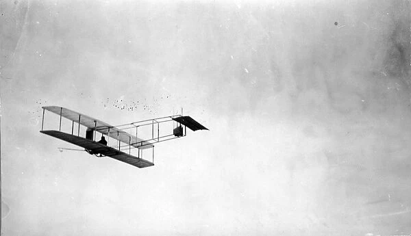 The 1911 Wright glider in flight with Orville Wright flying