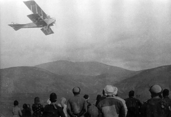 Albanians watching biplane, Serbia, WW1