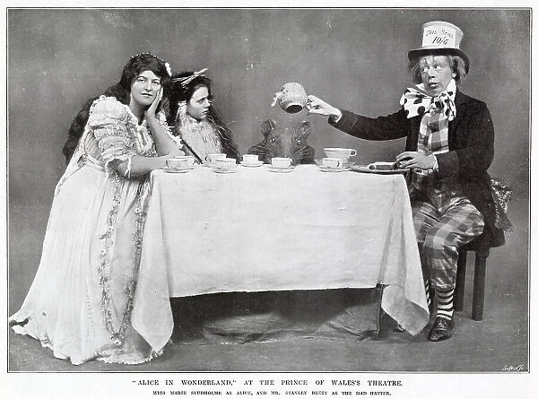 Alice in Wonderland Mad Hatters tea party starring Marie Studholme as Alice and Stanley Brett as the Mad Hatter at The Prince of Wales Theatre, West End, London. Date: 1907