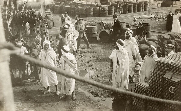 Arabs and others with oil barrels