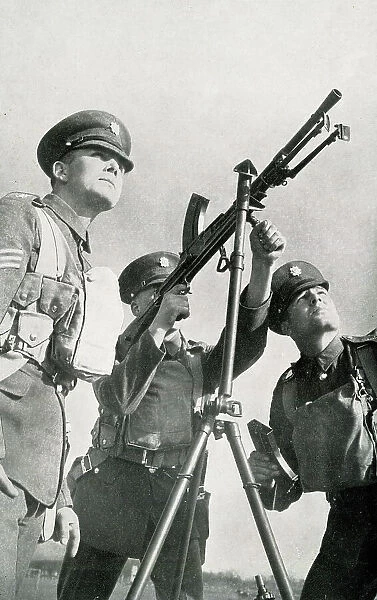 Army recruit learns to fire machine gun, WW2 preparations