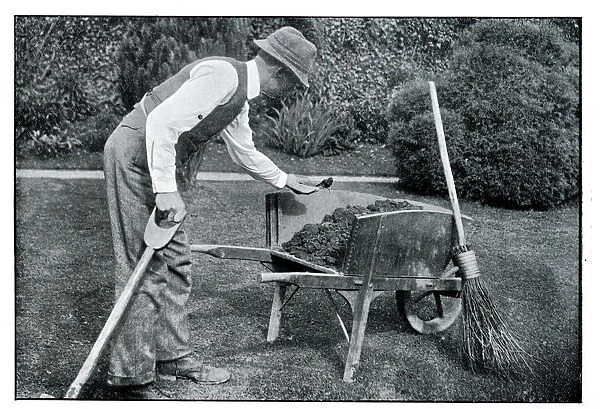 Arthur Trower gardening, with robin on wheelbarrow