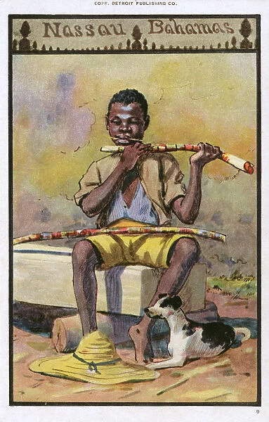 Boy chewing sugar cane - Nassau, Bahamas