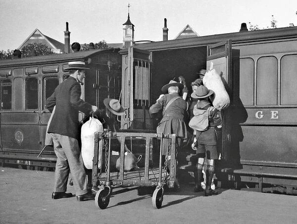 Boy scouts boarding a railway train