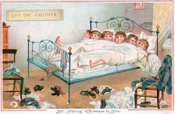 Six boys sharing a bed on a Christmas card