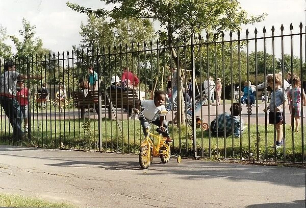 British Caribbean Heritage - Boy mounting his yellow bike