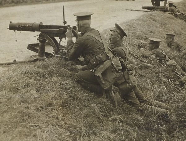 British, with machine guns, take up a position in a ditch in