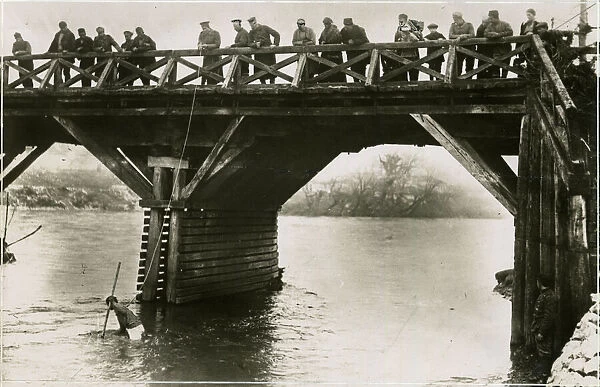 Bulgarian soldiers searching for guns in river, WW1