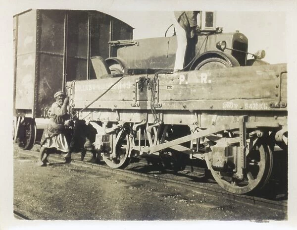 Car being loaded onto a train, Middle East