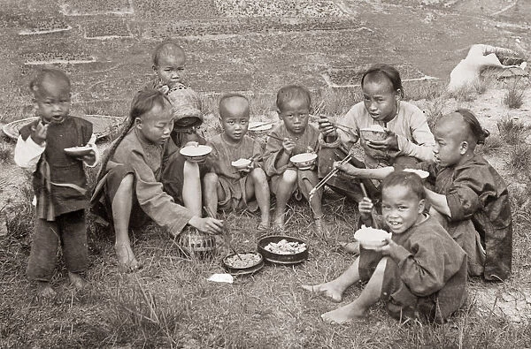 Chinese children eating with chopsticks, China c. 1890