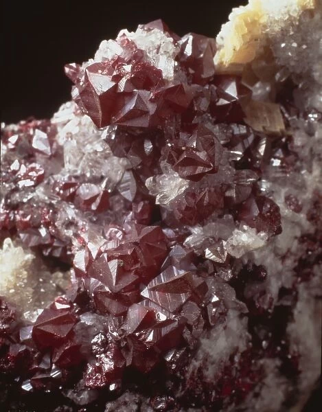 Cinnabar. Twinned dark red cinnabar crystals with small quartz crystals