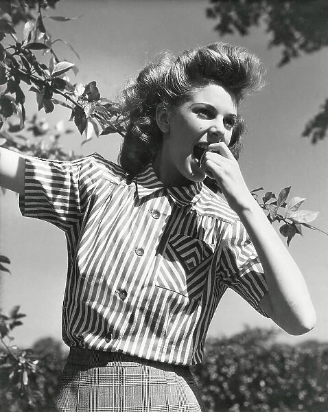 Client - W M Hollins - Girl in Striped blouse biting apple