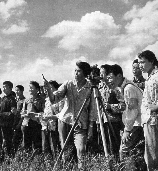 Communist China - surveying in a field