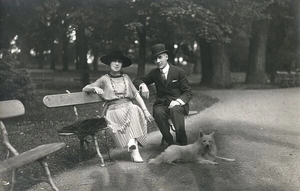 Couple in a park with a dog, France