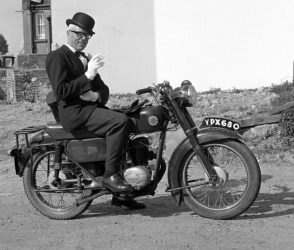 Well dressed man on a motorcycle
