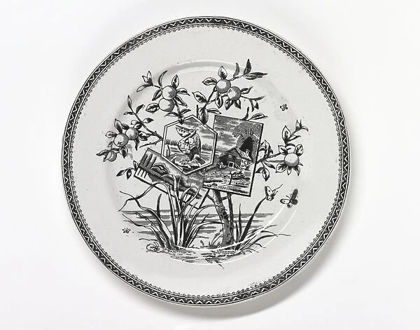Plate. One of three earthenware plates with a black