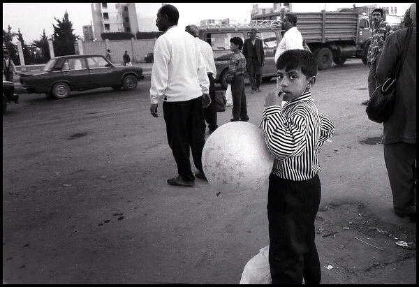 Egyptian boy with balloon Alexandria, Egypt. Date