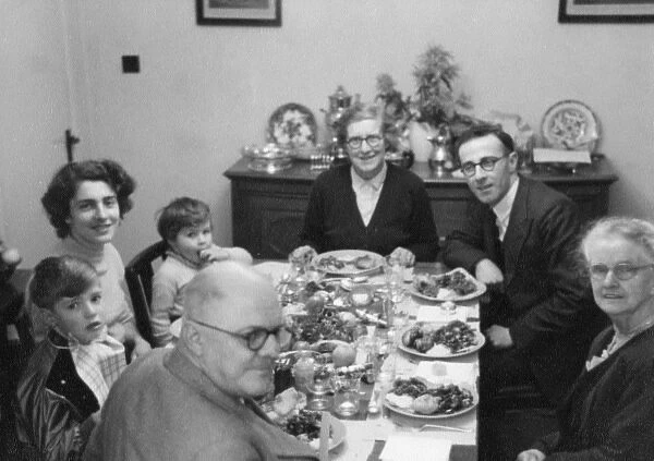 Extended family eating Christmas Dinner
