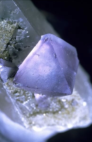 Fluorite. 6mm octahedral purple crystal on calcite collected from the Smith Vein, 1987