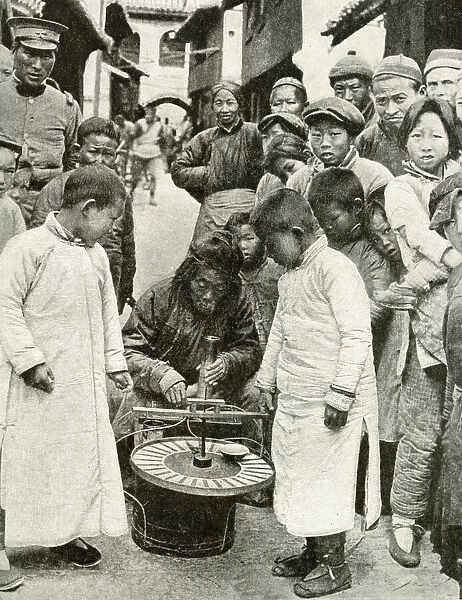 Gambling for sweets at roulette wheel, China, East Asia