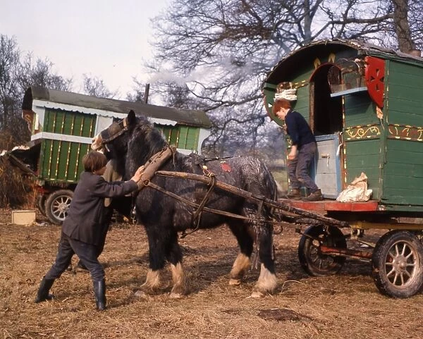 Gipsy boys with horse-drawn caravan