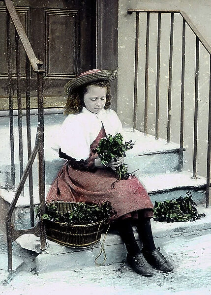 Girl with flower posy in the snow