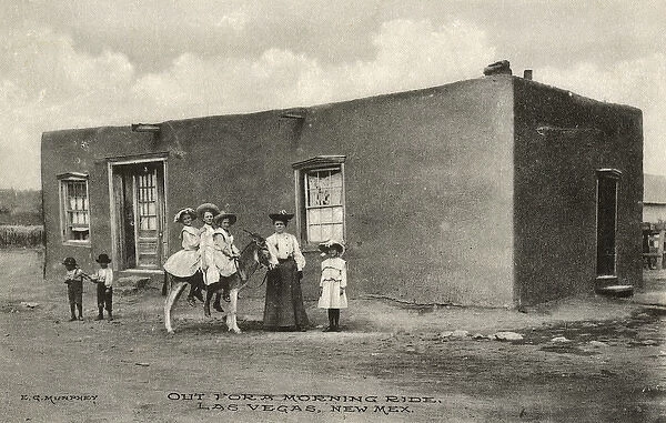 Three girls on a donkey, Las Vegas, New Mexico, USA