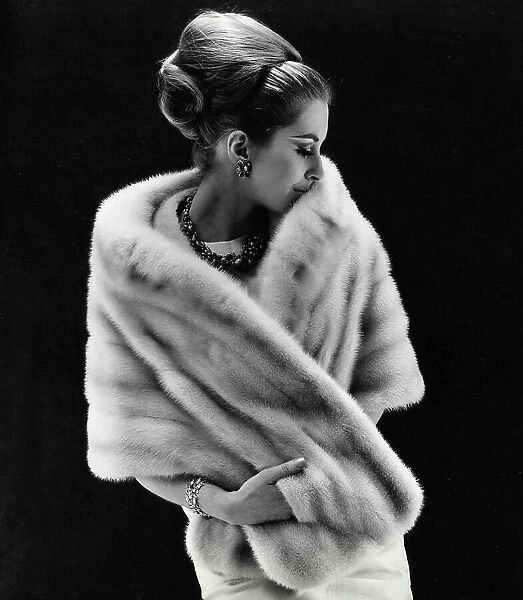 Glamorous model wrapped in an opulent fur stole