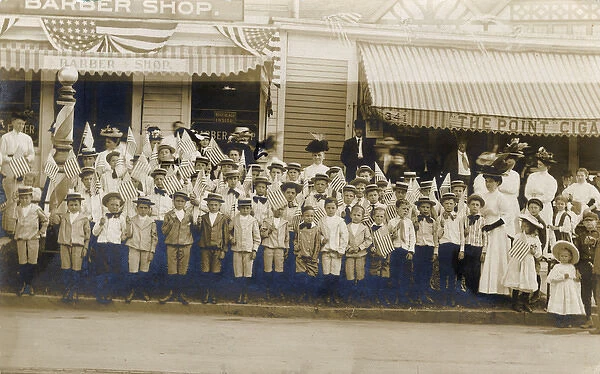 Group of adults and children with flags, USA