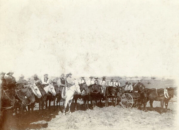 A group of cowboys in a field