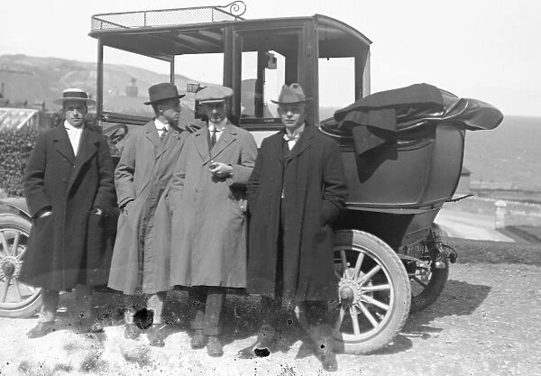Group of men by a car