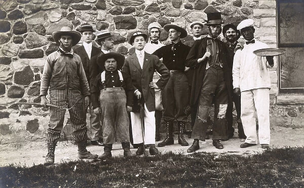 Group of men in fancy dress and makeup, USA