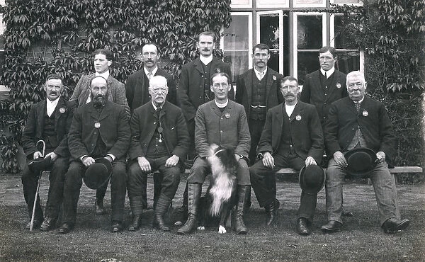 Group photo of men with a dog