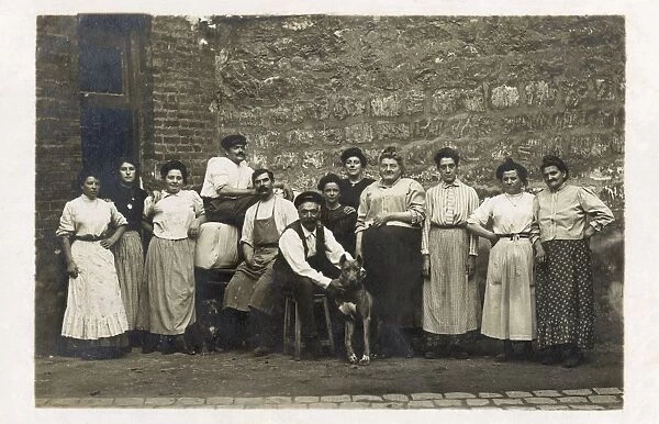 Group of working people with a dog, France