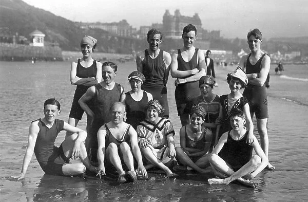 H. L. Oakley and others on the beach, Scarborough