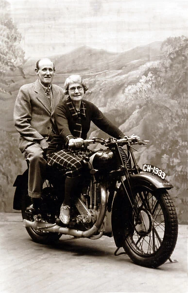 Lady and gentleman sat on a 1929 Coventry Eagle motorcycle