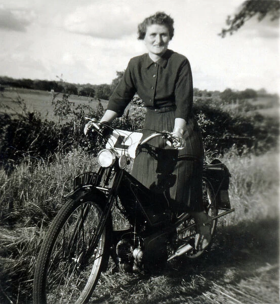 Lady learner on a 1930s  /  40s Velocette motorcycle