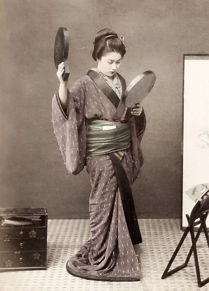 Late 19th century - young Japanese woman with mirrors