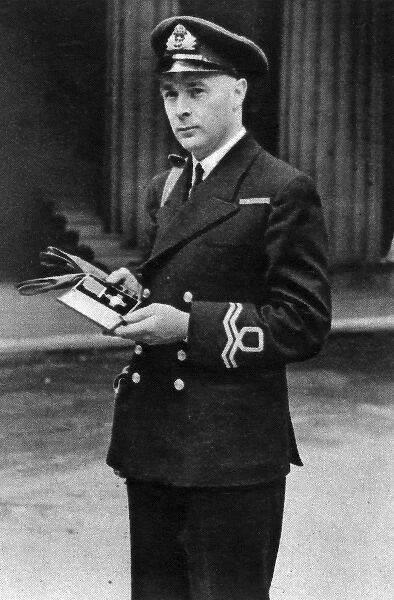 Lieutenant Ernest Gidden receiving the George Cross, 1942